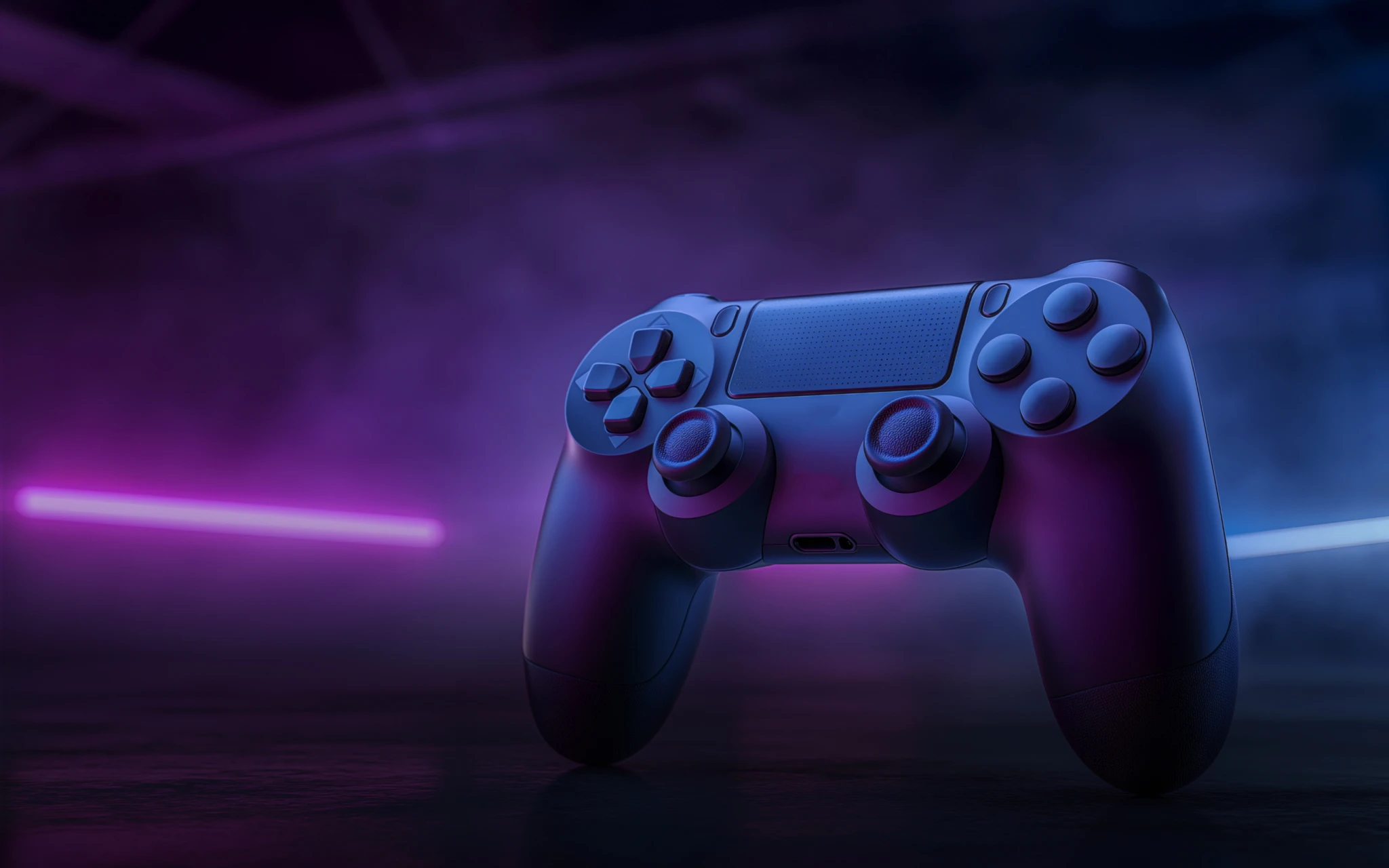 Game controller lit by purple and blue neon light