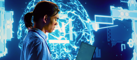 Data professional using a laptop with AI and neural network visualisation