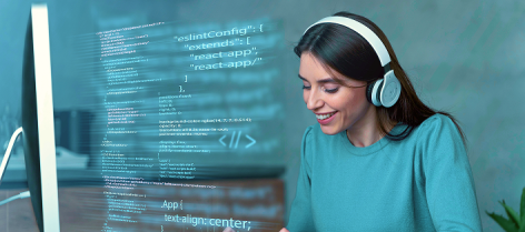Software developer reviewing code on a computer screen