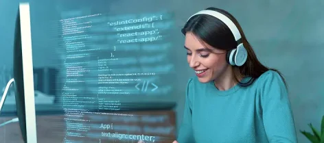 Software developer reviewing code on a computer screen